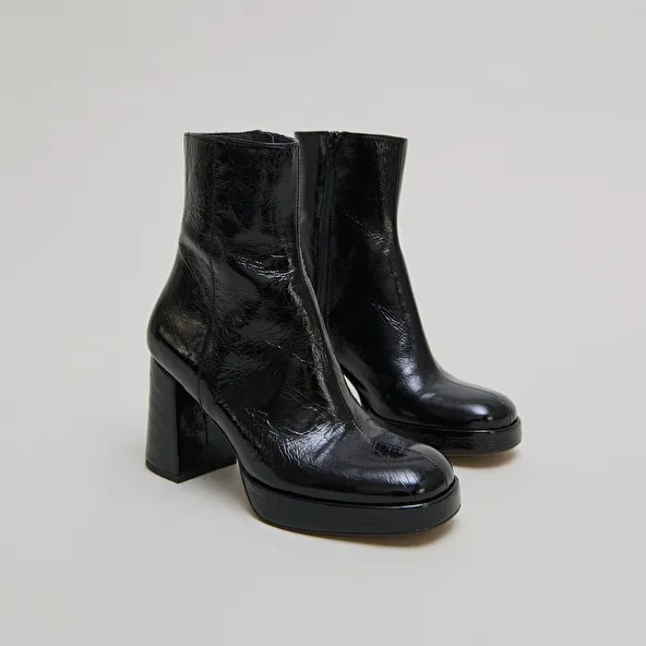 Platform boots with square toes in black shiny leather