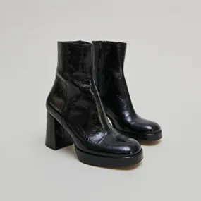 Platform boots with square toes in black shiny leather