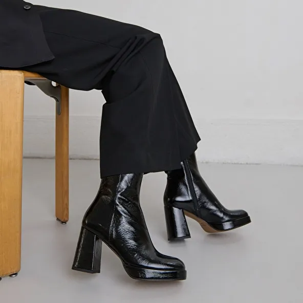 Platform boots with square toes in black shiny leather