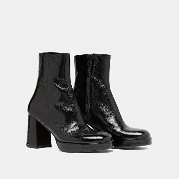 Platform boots with square toes in black shiny leather